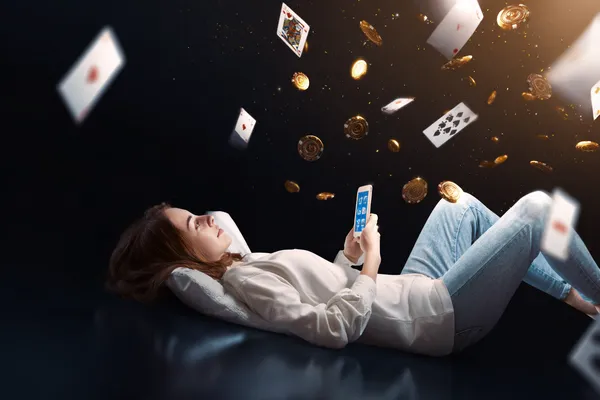 PJOK App — Enjoy seamless gaming on your smartphone A young woman relaxing with her phone while dynamic casino elements float around her, illustrating the smooth mobile experience offered by the PJOK app.